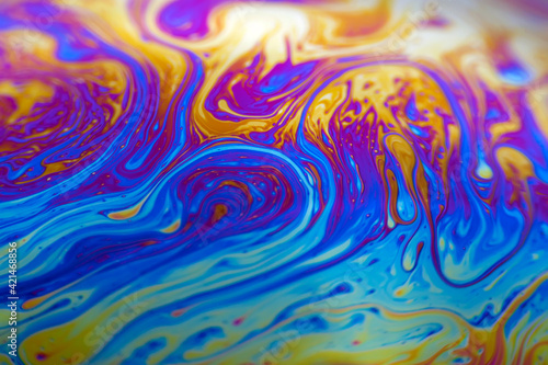 Colorful psychedelic soap bubble refractions pattern macro. Colorful macro Soap bubble iridescence