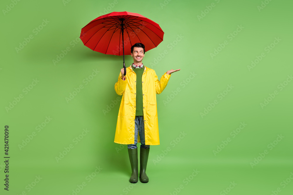Full length body size view of attractive cheerful guy wearing raincoat ...