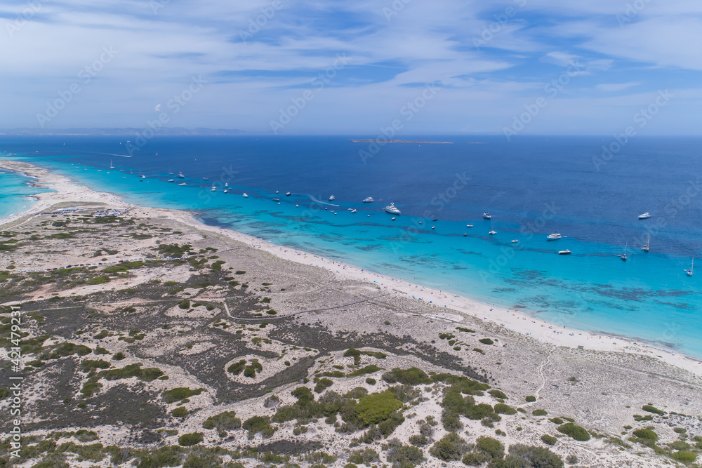 Amazing aerial of Formentera the Maldives of Europe with lots of boats and yachts in Ibiza Spain