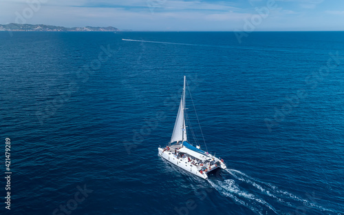 Aerial shot of yacht cruise at sea in Ibiza Spain © Pawel