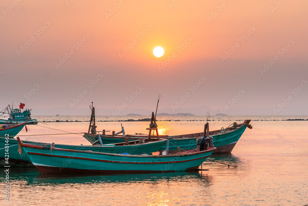 Sunset on the beautiful bay when the fishing boat faces the sun is also the end of the day at Ha Tien, Vietnam