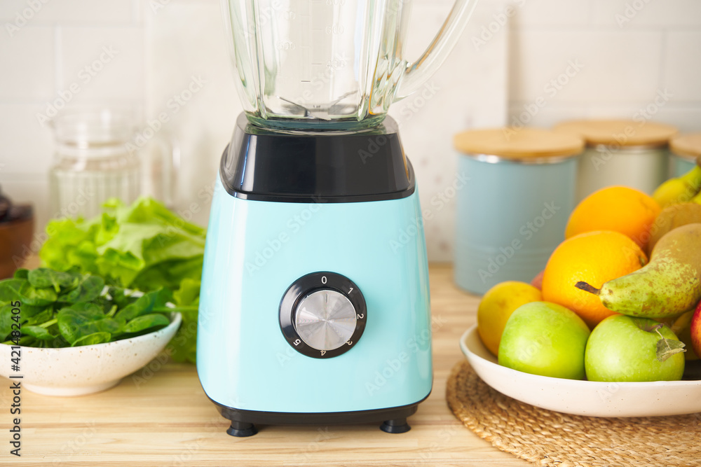 Blender and mixture of berries, fruits and vegetables for vegan green smoothie with fresh ingredients. Healthy vegetarian plant based organic food. Wellness with clean eating and balanced nutrition. Blender and mixture of berries, fruits and vegetables for vegan green smoothie with fresh ingredients. Healthy vegetarian plant based organic food. Wellness with clean eating and balanced nutrition.