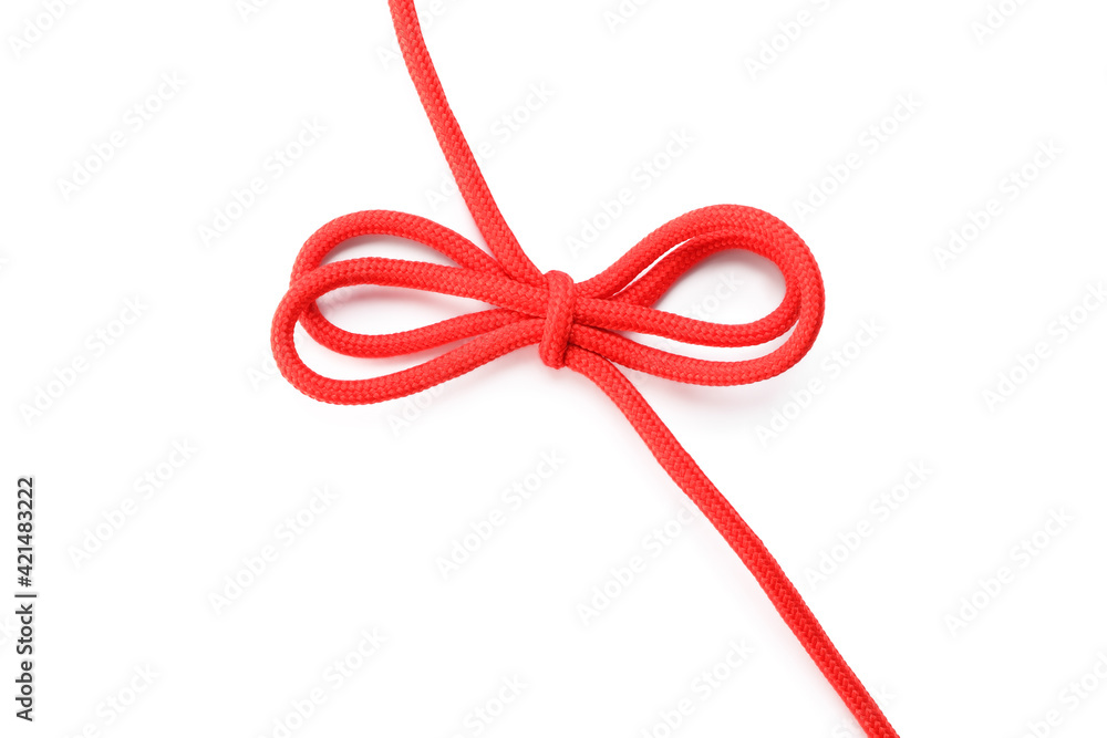Red shoe lace tied in bow isolated on white, top view Red shoe lace tied in bow isolated on white, top view