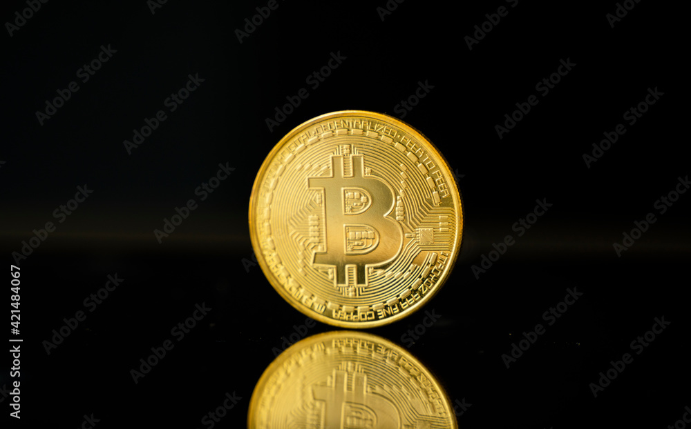 Gold bitcoin coin. Trading on the cryptocurrency exchange. Cryptocurrency Stock Market Concept. Virtual money concept. Mining or blockchain technology. Gold bitcoin coin. Trading on the cryptocurrency exchange. Cryptocurrency Stock Market Concept. Virtual money concept. Mining or blockchain technology.