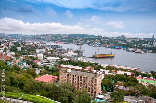 Cityscape panorama of Vladivostok downtown and Zolotoy Rog  Golden Horn Bay  from the top of the Eagle s Nest hill on a sunny day