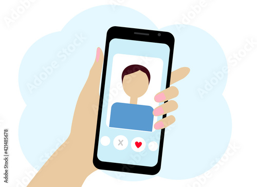 Hand with the phone. The phone has an online dating program.