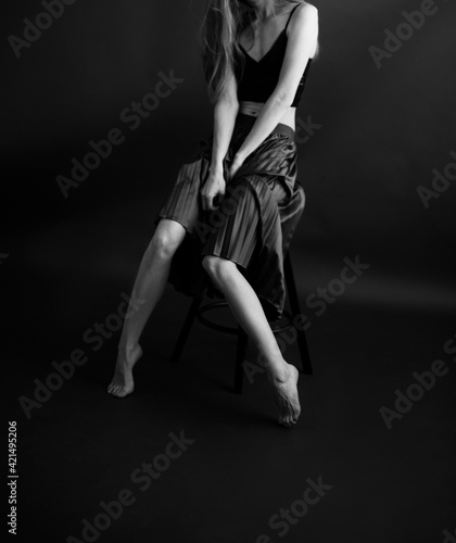 beautiful female legs, black and white portrait of human body parts, fuzzy and noisy film photography, art and fashion