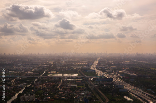 Aerial view landscape of Bangkok from the plane in fog with clouds, Thailand. © Evgeniya Biriukova