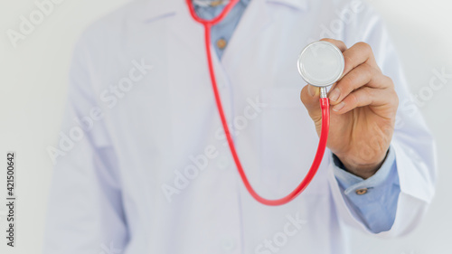 The sound of a stethoscope in the hand of the young doctor is holding