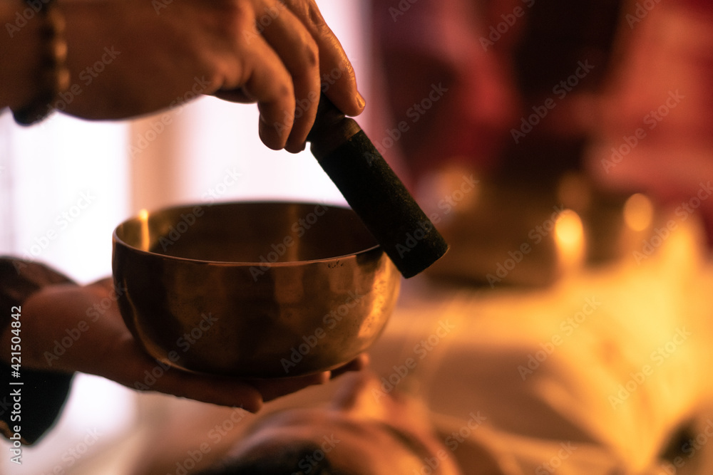 © Fabio Principe - Soft focus view of a woman practicing holistic activities with Tibetan bells. Meditation and mindfulness exercises for calm and clear your mind. Wellness, health, relax, and inner well-being concept. © Fabio Principe - Soft focus view of a woman practicing holistic activities with Tibetan bells. Meditation and mindfulness exercises for calm and clear your mind. Wellness, health, relax, and inner well-being concept.