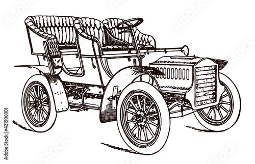 Antique four-seater tonneau touring car in three-quarter view with open door
