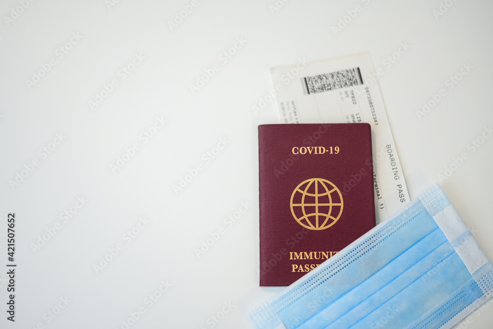 Close up of passport, boarding pass and medical mask. Ready to departure for a trip during Coronavirus pandemic. Closure of airports restricted traveling. New rules. Business travel health concept. Close up of passport, boarding pass and medical mask. Ready to departure for a trip during Coronavirus pandemic. Closure of airports restricted traveling. New rules. Business travel health concept.