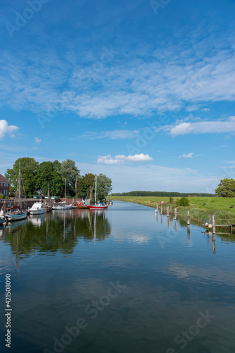 Sailboats in the old harbor of Hooksiel