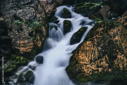 Long exposure of one of the Gollinger Wasserfalls next to the town of Golling an der Salzach, Austria. A mighty stream of water sprays over rocks and rock. A very important tourist place in Austria photo