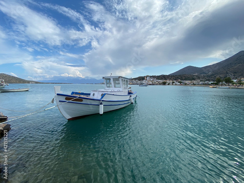 Elounda harbour with white boat