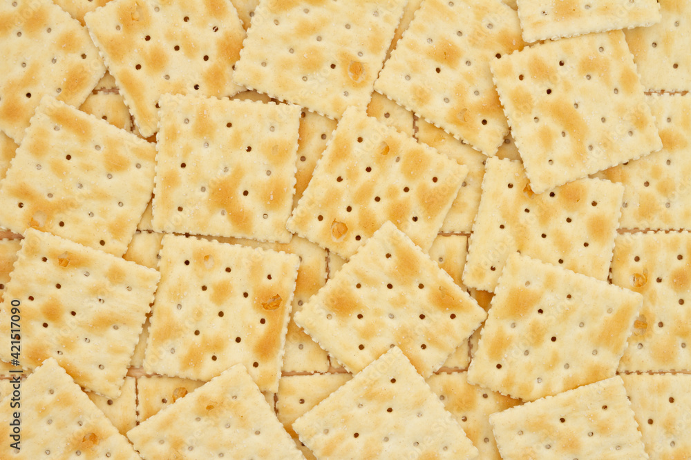 Saltine crackers in pile background Saltine crackers in pile background