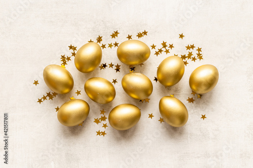 Golden Easter eggs with decoration. Wealth and good luck concept.