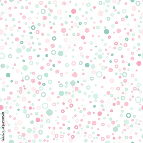 Seamless abstract pattern of little circles of pink and green pastel colors.