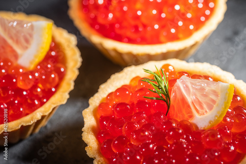 tartalets with salmon and caviar photo