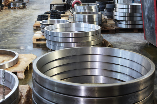 Ready-made large diameter bearings at factory.Finished products of the bearing factory. Heavy industry concept. Metal products.