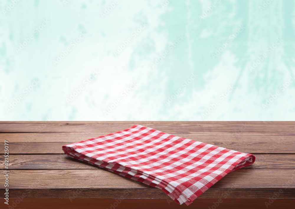 Kitchen towel on empty wooden table. Napkin close up top view mock up for design. Kitchen rustic background. Kitchen towel on empty wooden table. Napkin close up top view mock up for design. Kitchen rustic background.