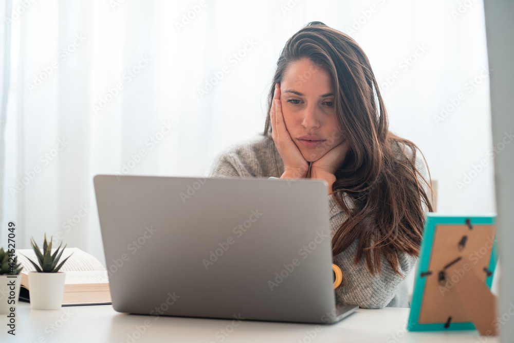 young woman teleworking at home with computer young woman teleworking at home with computer