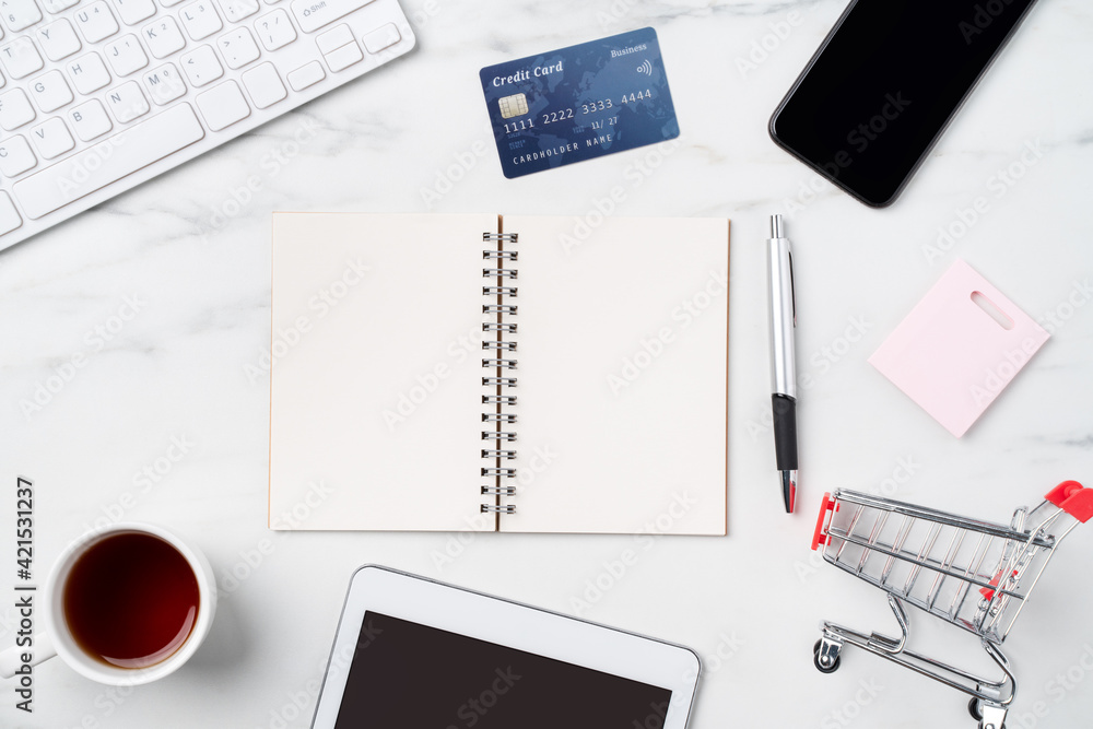 Top view of online shopping concept with credit card and electronics. Top view of online shopping concept with credit card and electronics.