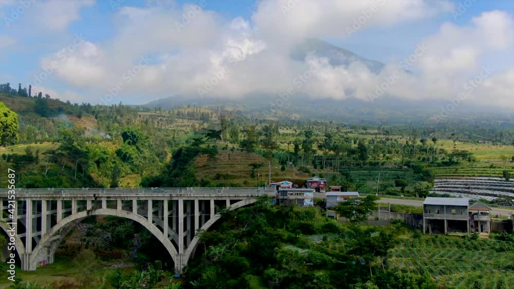 Concrete Sigandul Bridge and Mount Sumbing in Central Java aerial panorama Concrete Sigandul Bridge and Mount Sumbing in Central Java aerial panorama