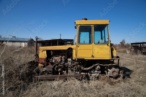 Old and rusty yellow bulldozer.