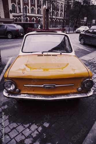 retro car auto yellow on the street of the city small funny © evgris