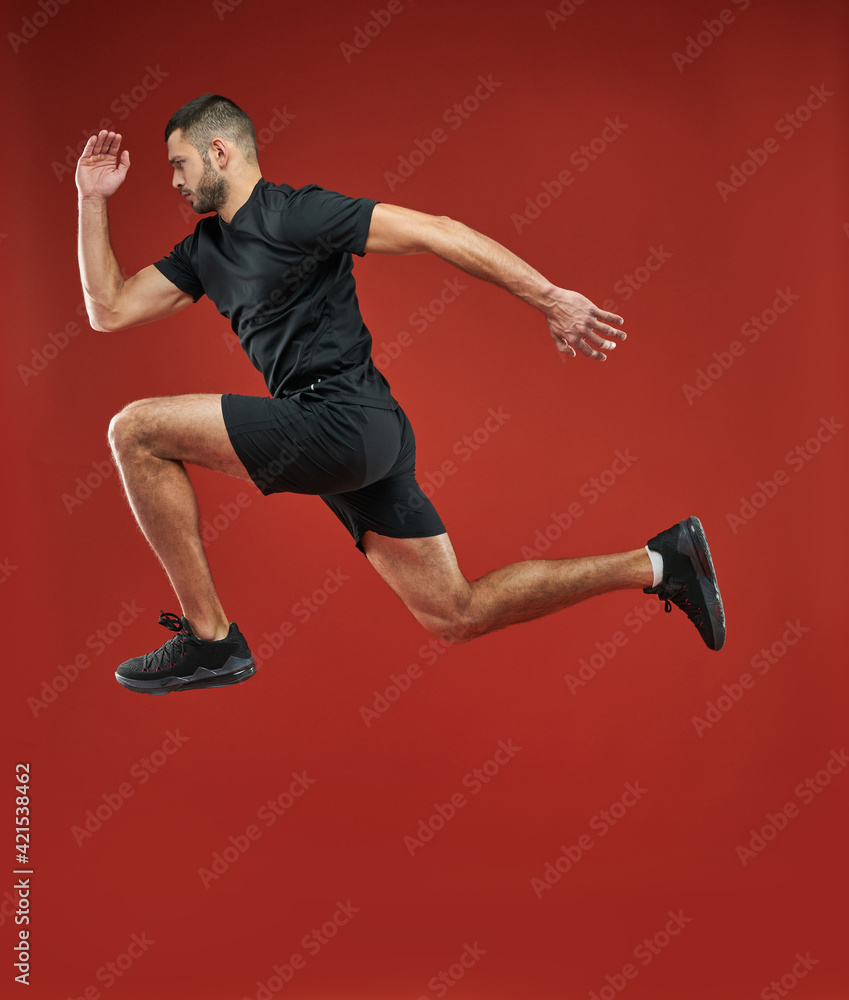 Fototapeta premium Adult strong athlete man in action in the indoors