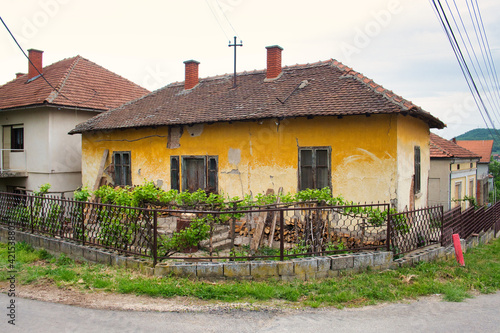 Old abandoned house in the traditional mountain village in Eastern Serbia photo