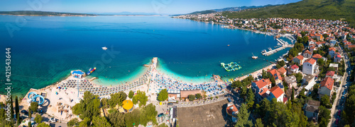 Fotografie Tourist town of Selce and Poli Mora turquoise beach aerial panoramic view