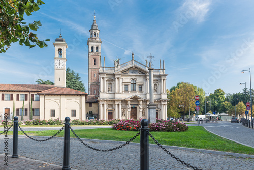 Traffic island with flowers, urban landscaping. Saronno, Italy and the Sanctuary of Our Lady of the Miracles declared part of the European Heritage. Was built between 1498 to beginning 1600