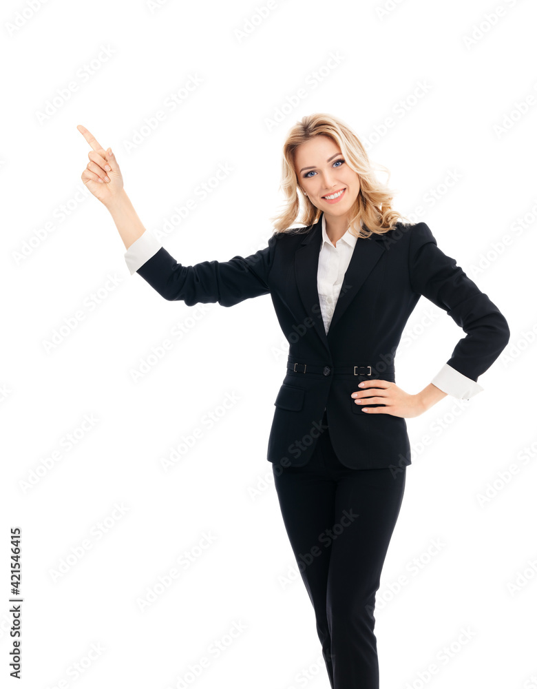 Happy smiling young businesswoman, pointing at something or showing copy space area for slogan or text, isolated over white background. Portrait of business woman at studio. Happy smiling young businesswoman, pointing at something or showing copy space area for slogan or text, isolated over white background. Portrait of business woman at studio.