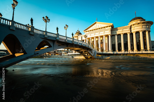 View of The Eye Bridge over Vardar River in front of Archaeological Museum of Macedonia in Skopje city photo