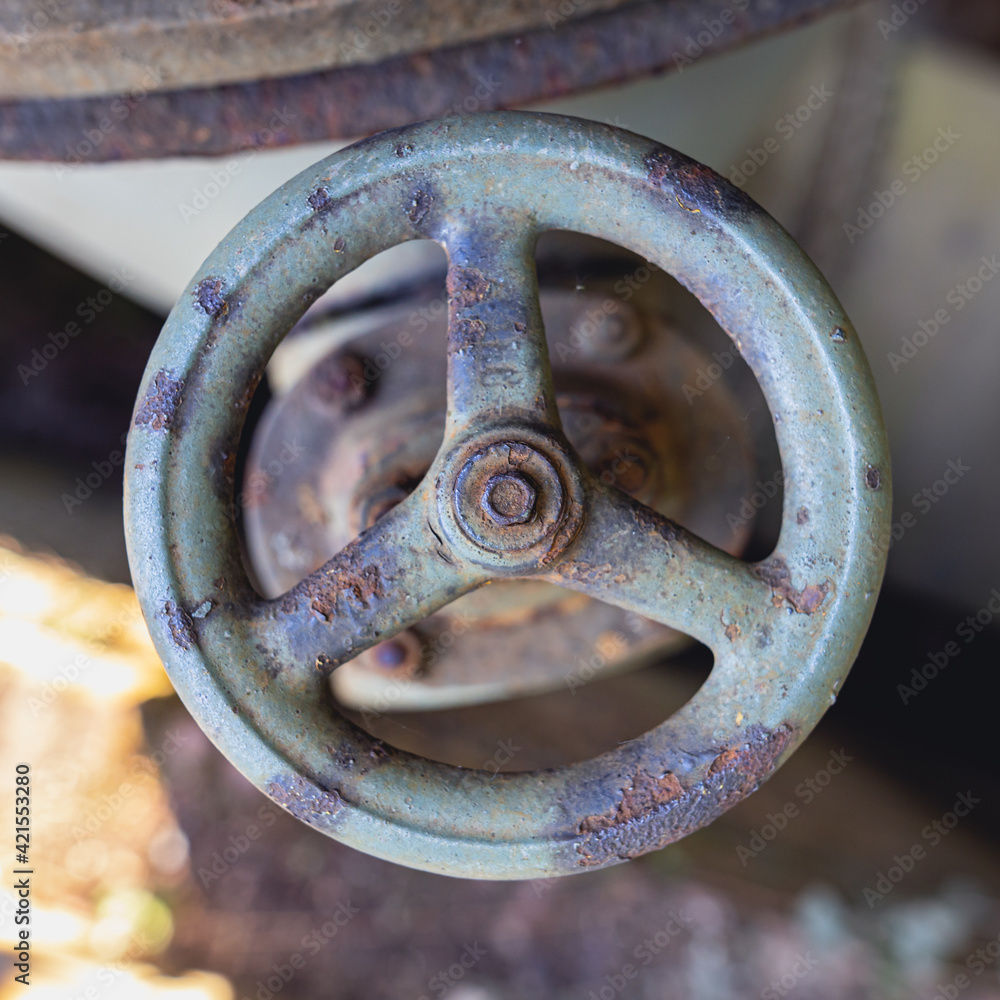rusty old valve control wheel in Landschaftspark Duisburg rusty old valve control wheel in Landschaftspark Duisburg