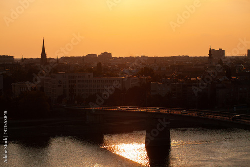 View of Varadin Bridge over Danube river and city during sunrise, Novi Sad city photo