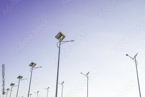 Solar cell lamp electricity system for alternative power energy on street with green tree nature, Future renewable supply source