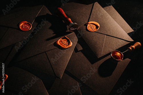 black postage envelopes with wax sea lthe envelope photo