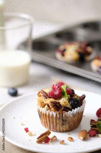 mixed berry low carb Keto Diet muffin with almond and nut. set on cafe table.