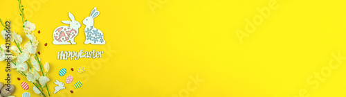 Easter banner on a yellow background, copy space and top view, concept for holiday
