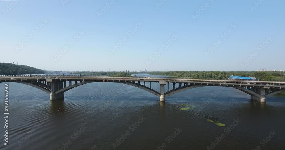 Aerial: Transport Flow And Train Cross The River Over Bridge Aerial: Transport Flow And Train Cross The River Over Bridge