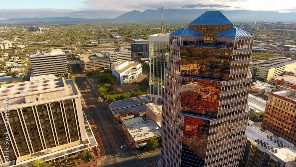 Cinematic rotating drone shot of downtown Tucson Arizona and surrounding urban sprawl