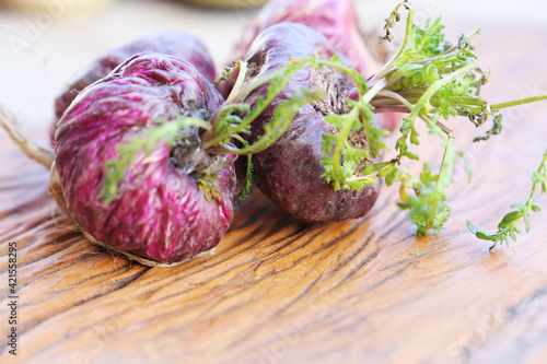 Fresh maca roots or Peruvian ginseng (lat. Lepidium meyenii) with maca products (maca powder) 