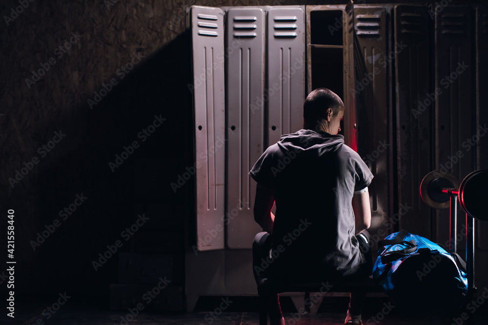 Man get ready for boxing training in the locker room Man get ready for boxing training in the locker room
