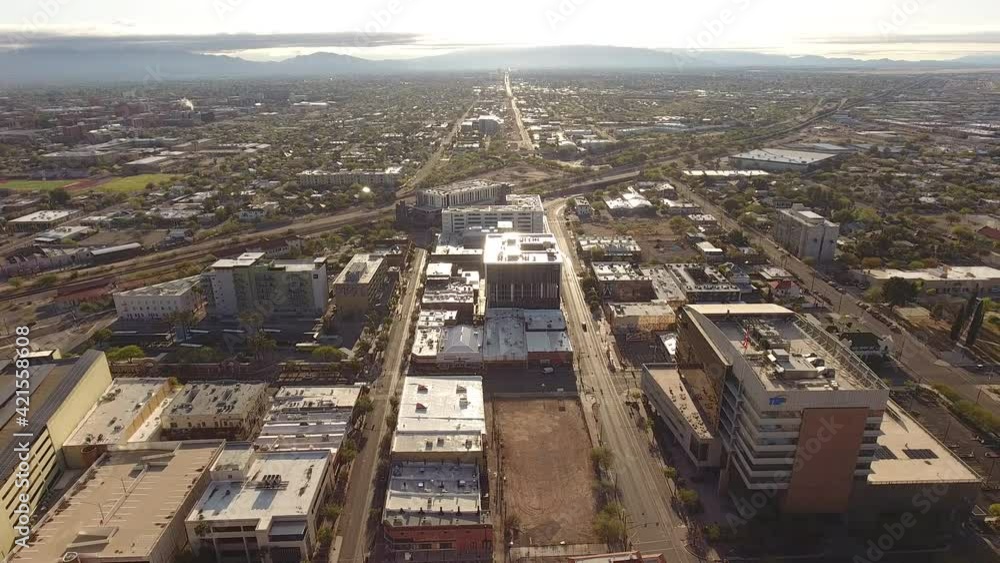 Revealing drone shot starting on city and then passing over skyscapers in downtown Tucson Arizona into the sun Revealing drone shot starting on city and then passing over skyscapers in downtown Tucson Arizona into the sun