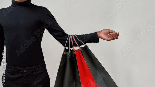 Shopping packets on hand of young african american guy
