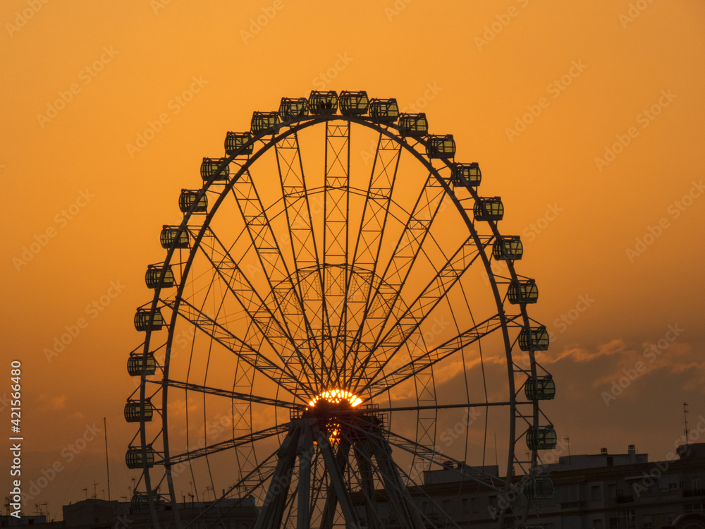Malaga, Costa del sol, Spain. Sunset over the Ferris wheel 