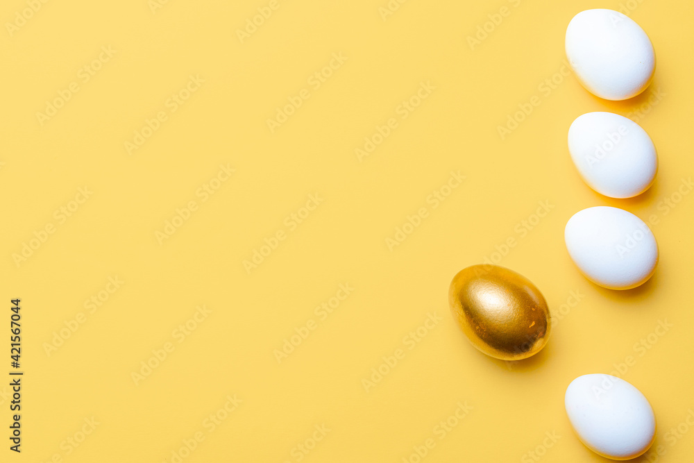 Easter decoration. Golden, white colour egg on pastel yellow background in Happy Easter decoration. Foil minimalist egg design with copy space. Easter decoration. Golden, white colour egg on pastel yellow background in Happy Easter decoration. Foil minimalist egg design with copy space.